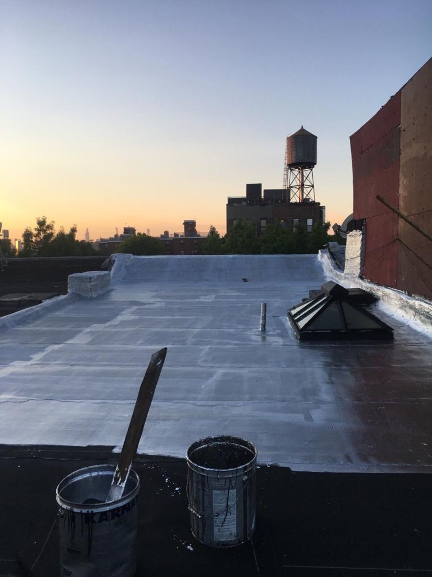 Completed roof with new modified bitumen membrane.