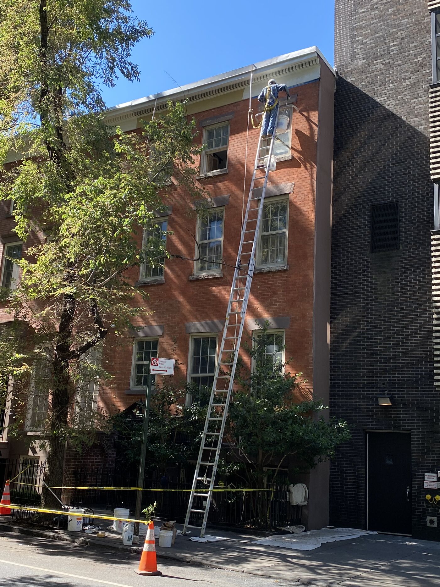 Restored facade with cornice and brownstone work integrated.
