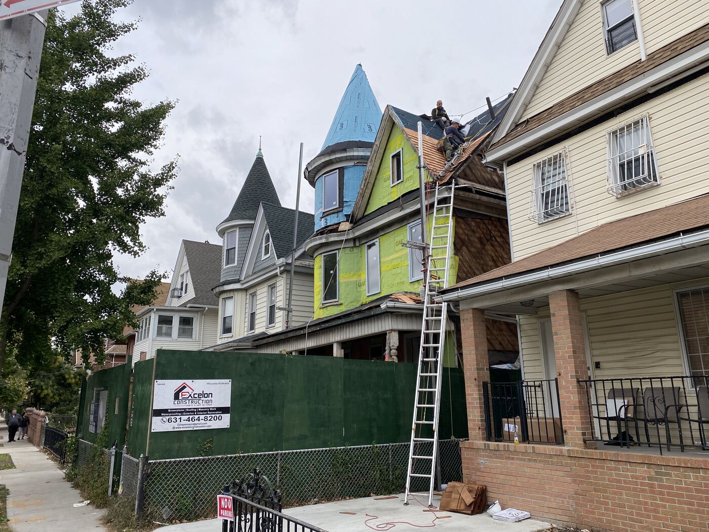 Completed cedar shingle facade on the Victorian home.