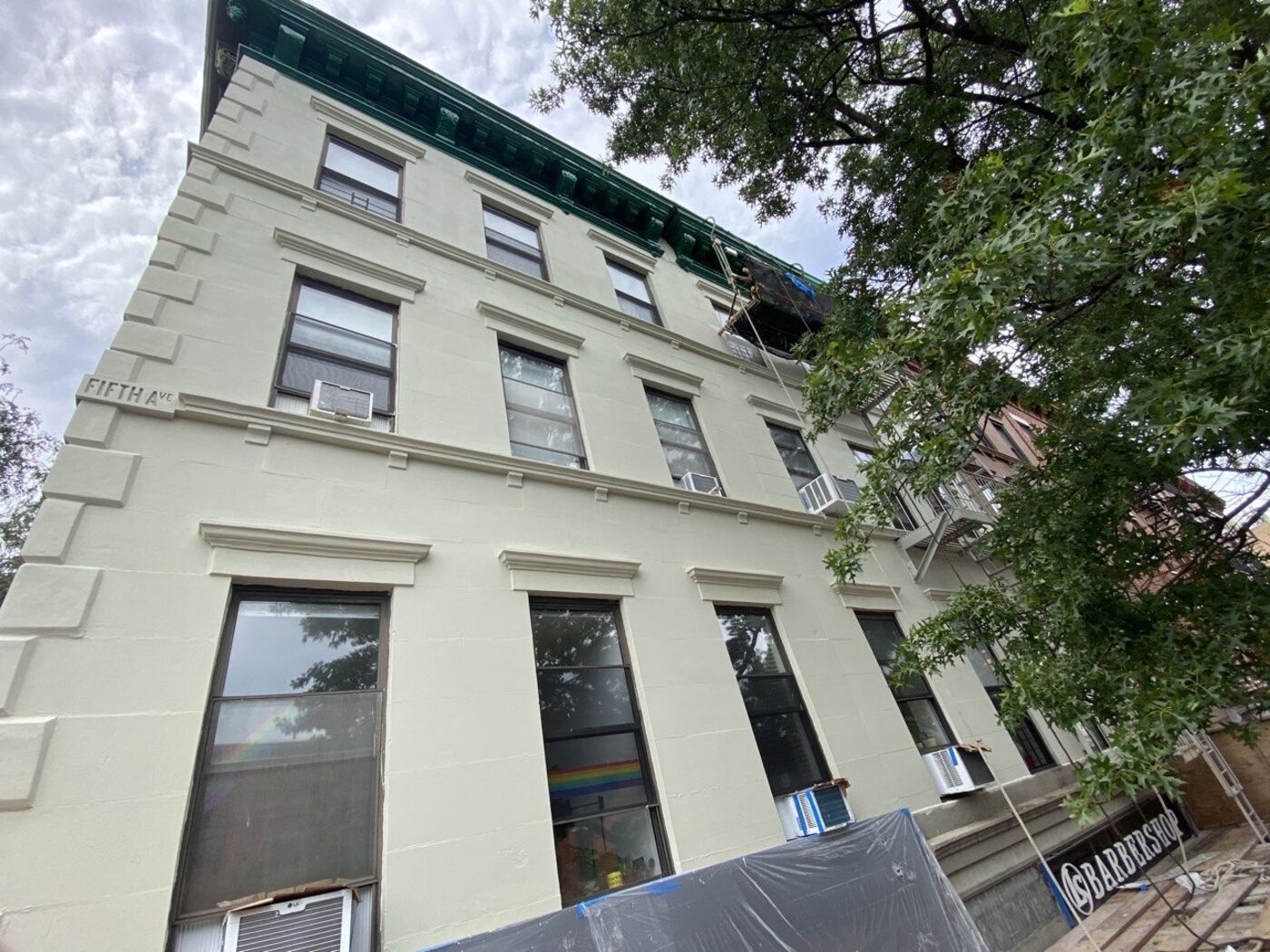 Top section of facade showing cornice in context with masonry.